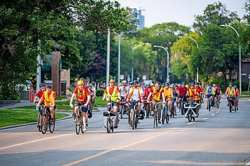 NIC ADAM / FREE PRESS
Hundreds of winnipeggers cycled to the memorial honouring the life of cyclist Rob Jenner, who lost his life to a hit-and-run driver on Wellington Crescent at Cockburn Street, pictured Thursday afternoon.
240725 - Thursday, July 25, 2024.

Reporter: Jura