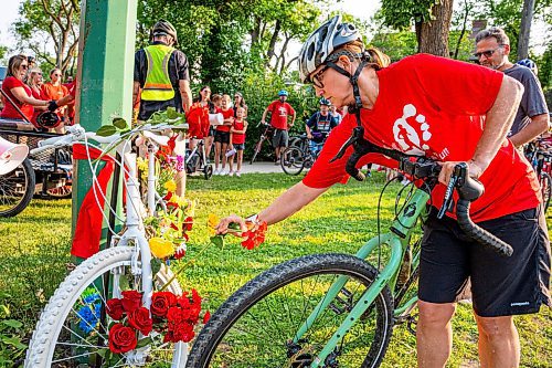 NIC ADAM / FREE PRESS
Winnipeg&#x2019;s cycling community held a group ride and ghost bike installation honouring the life of cyclist Rob Jenner who lost his life to a hit-and-run driver on Wellington Crescent at Cockburn Street on the morning of June 6, 2024, during his commute to work.
240725 - Thursday, July 25, 2024.

Reporter: Jura