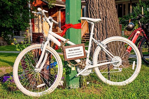 NIC ADAM / FREE PRESS
The memorial ghost bike honouring the life of cyclist Rob Jenner, who lost his life to a hit-and-run driver on Wellington Crescent at Cockburn Street, pictured Thursday afternoon.
240725 - Thursday, July 25, 2024.

Reporter: Jura