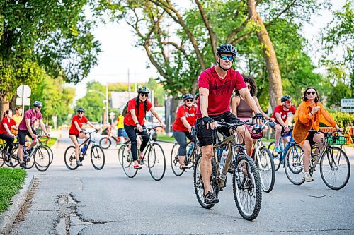 NIC ADAM / FREE PRESS
Hundreds of winnipeggers cycled to the memorial honouring the life of cyclist Rob Jenner, who lost his life to a hit-and-run driver on Wellington Crescent at Cockburn Street, pictured Thursday afternoon.
240725 - Thursday, July 25, 2024.

Reporter: Jura