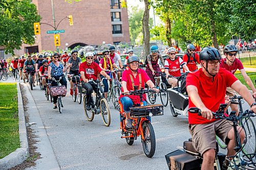 NIC ADAM / FREE PRESS
Hundreds of winnipeggers cycled to the memorial honouring the life of cyclist Rob Jenner, who lost his life to a hit-and-run driver on Wellington Crescent at Cockburn Street, pictured Thursday afternoon.
240725 - Thursday, July 25, 2024.

Reporter: Jura