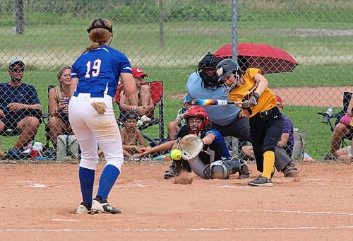 Under-15 Westman Heat batter Ella Kulchyski puts the ball in play as Eastman Blades pitcher Reese Friesen, catcher Amy Christie and umpire Damien Mathys look on during their game in Softball Manitoba's U15 AA provincials at Steve Clark Field on Friday afternoon. (Perry Bergson/The Brandon Sun)
July 26, 2024