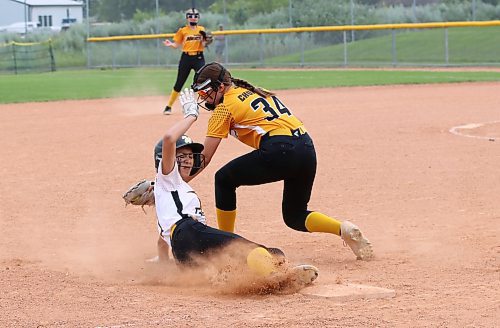 Under-13 Westman Fury base runner Aubrey Wilson slides in just ahead of a tag by Westman Heat third baseman Jessa Church (34) during their game in Softball Manitoba's U13 AA provincials at Ashley Neufeld Softball Complex on Friday. The Heat won 7-5. (Perry Bergson/The Brandon Sun)
July 26, 2024