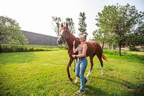 MIKAELA MACKENZIE / FREE PRESS

Groom Katie Morris with Manitoba Derby contender No Show No Call at the Assiniboia Downs on Friday, July 26, 2024. 

For George story.