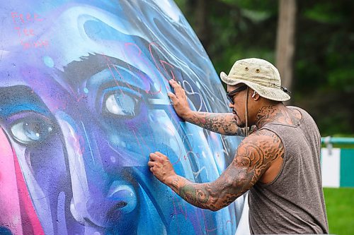 Mike Sudoma/Free Press
Artist Pat Lazo cleans up a plethera of graffiti tags on the mural of Sk8 Skates founder Jai Pereira at the bowl at the Forks Plaza Friday morning
July 26, 2024
