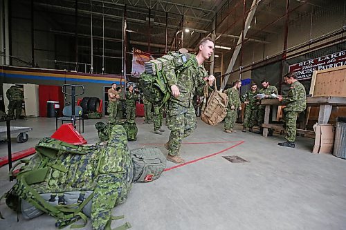 Soldiers with the 2nd Battalion, Princess Patricia's Canadian Light Infantry at CFB Shilo pack up their backpacks and other equipment for the journey west to Alberta on Friday morning. The company of about 75 troops has been deployed to help battle the raging wildfires in Alberta that most recently destroyed nearly half of the community of Jasper. (Matt Goerzen/The Brandon Sun)