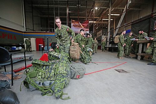 Soldiers with the 2nd Battalion, Princess Patricia's Canadian Light Infantry at CFB Shilo pack up their backpacks and other equipment for the journey west to Alberta on Friday morning. The company of about 75 troops has been deployed to help battle the raging wildfires in Alberta that most recently destroyed nearly half of the community of Jasper. (Matt Goerzen/The Brandon Sun)