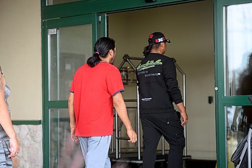 Mike Sudoma/Free Press
Families walk into a hotel where fire evacuees from Marcel Colomb First Nation register to receive aid from Red Cross Friday afternoon
July 26, 2024
