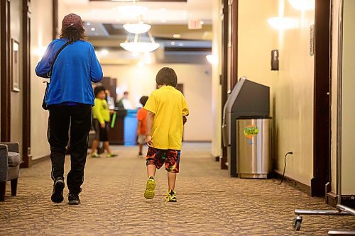 Mike Sudoma/Free Press
Evacuees from Marcel Colomb First Nation walk down a hallway after registering to receive aid from Red Cross Friday afternoon
July 26, 2024
