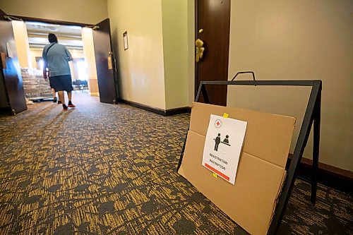 Mike Sudoma/Free Press
Evacuees from Marcel Colomb First Nation walk into reception register to receive aid from Red Cross Friday afternoon
July 26, 2024
