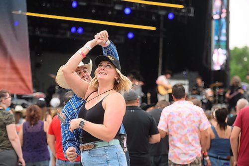 Mike Sudoma/Free Press
(Left to right) Christopher twirls Dana Crane at the Country Rising Music Festival at Blue Cross Park Friday afternoon
July 26, 2024
