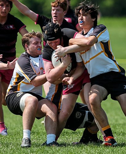 JOHN WOODS / FREE PRESS
Manitoba&#x573; Mike Dynkavich (2) and Alex De Groot (11)  defend against Alberta&#x573; Adam Jossy (2) during the U19 final of the Prairie Cup Rugby Tournament at Maple Grove Rugby Park Sunday, July 28, 2024. Alberta went on to defeat Manitoba for the championship.

Reporter: standup