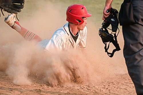 Mike Sudoma/Free Press
Oildomes Aidan McCoy slides into home plate during the AAA Baseball Manitoba Provincial Championships Sunday evening at Charleswood Place field
July 28, 2024
