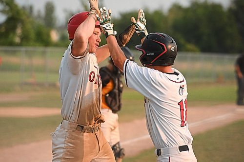 Mike Sudoma/Free Press
Oildome players share a moment after a run during  the AAA Baseball Manitoba Provincial Championships Sunday evening at Charleswood Place field
July 28, 2024
