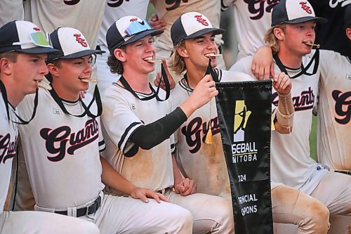 Mike Sudoma/Free Press
The Elmwood Giants share a moment with their 1st place medals and banner after winning the AAA Baseball Manitoba Provincial Championships Sunday evening at Charleswood Place field
July 28, 2024
