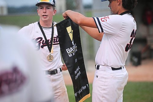 Mike Sudoma/Free Press
The Elmwood Giants share a moment with their 1st place medals and banner after winning the AAA Baseball Manitoba Provincial Championships Sunday evening at Charleswood Place field
July 28, 2024
