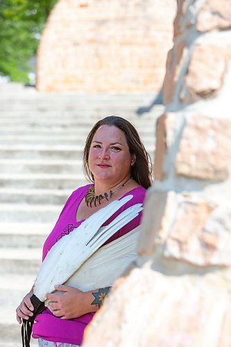 BROOK JONES / FREE PRESS
Jaime Grasby, 43, who is an indigenous story teller and knowledge keeper holds smuding feather fans as she is pictured in the Oodena Celebration Circle at The Forks in Winnipeg, Man., Thursday, July 11, 2024.