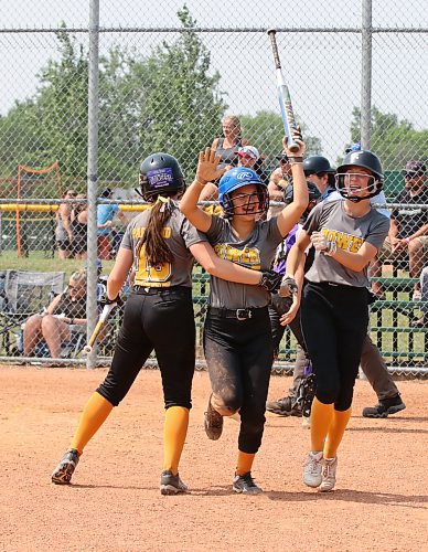 Harmony Semeniuk of the under-13 AA Parkland Power, middle, celebrates her home run with Ava Thompson (19), left, and Chayse Paradis, right, during the final of the Softball Manitoba&#x2019;s U13 AA provincial championship against Central Charge-Smith at Ashley Neufeld Softball Complex on Sunday. (Perry Bergson/The Brandon Sun)