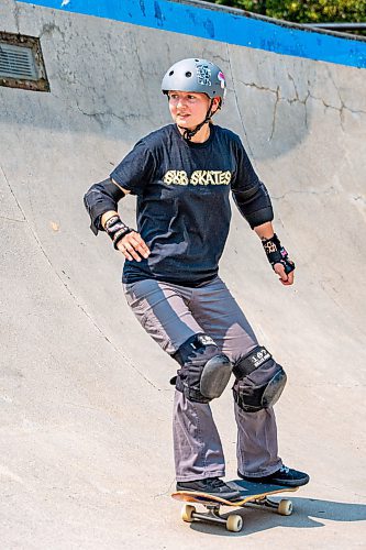 NIC ADAM / FREE PRESS
Liz Miller, who&#x2019;s been skating for a year, is pictured riding her skateboard at The Forks during her lunch break Monday.
240729 - Monday, July 29, 2024.

Reporter:?