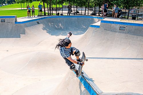 NIC ADAM / FREE PRESS
Multimedia specialist Eric Santiago, 59, shown riding his skateboard at The Forks during his lunch break Monday. He&#x2019;s been riding &#x201c;since forever&#x201d; and says anyone of any age can learn as long as they&#x2019;re determined.
240729 - Monday, July 29, 2024.

Reporter:?