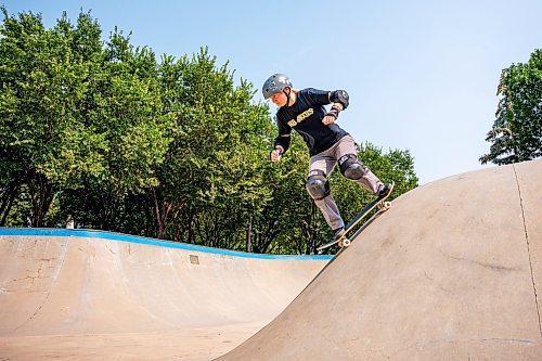 NIC ADAM / FREE PRESS
Liz Miller, who&#x2019;s been skating for a year, is pictured riding her skateboard at The Forks during her lunch break Monday.
240729 - Monday, July 29, 2024.

Reporter:?