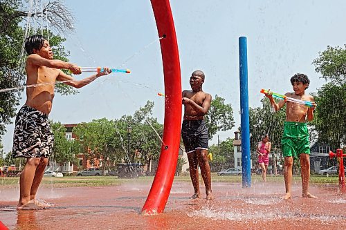 29072024
JJ Corsino, Victor Aguwa and Rocklin Lessey-Goodon play together in the cool spray at the Stanley Park spray park on a hot Monday afternoon as part of the Manitoba Possible Deaf and Hard of Hearing Day Camp. Participants in the week-long summer camp will also be going bowling, doing pottery, swimming, visiting the Riverbank Discovery Centre and taking part in other activities. 
(Tim Smith/The Brandon Sun)