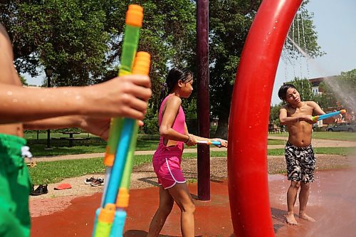 29072024
Rocklin Lessey-Goodon, Zoey Corsino and JJ Corsino play together in the cool spray at the Stanley Park spray park on a hot Monday afternoon as part of the Manitoba Possible Deaf and Hard of Hearing Day Camp. Participants in the week-long summer camp will also be going bowling, doing pottery, swimming, visiting the Riverbank Discovery Centre and taking part in other activities. 
(Tim Smith/The Brandon Sun)