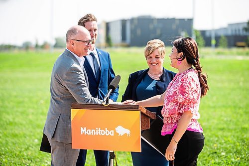 MIKAELA MACKENZIE / FREE PRESS

	
Mayor Scott Gillingham (left), MLA David Pankratz, MLA Lisa Naylor, and MLA Jennifer Chen shake hands after speaking to the media about the South Winnipeg Recreation Complex in Bridgwater on Tuesday, July 30, 2024. 

For Jordan story.