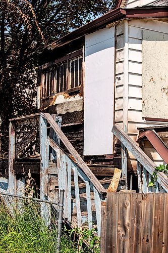 MIKAELA MACKENZIE / FREE PRESS

	
The scene of a recent fire at a vacant, boarded-up bungalow on Burrows Avenue on Tuesday, July 30, 2024. 

For Nicole story.