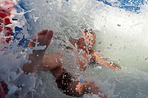 30072024
Dierk Anderson kicks up a big splash of foamy water while beating the heat on Tuesday on a large inflatable slide at the Anderson&#x2019;s home east of Souris during a birthday party for Kord Anderson, who turns twelve today. (Tim Smith/The Brandon Sun)