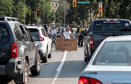 JOHN WOODS / FREE PRESS
About 180 cyclists blocked cars at the intersection of Academy and Wellington Tuesday, July 30, 2024. Cyclists want safe infrastructure after a child was hit by a driver at the intersection yesterday.

Reporter: ?