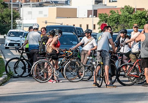 JOHN WOODS / FREE PRESS
About 180 cyclists blocked cars at the intersection of Academy and Wellington Tuesday, July 30, 2024. Cyclists want safe infrastructure after a child was hit by a driver at the intersection yesterday.

Reporter: ?