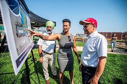 MIKAELA MACKENZIE / FREE PRESS

	
Diljeet Brar, MLA for Burrows (left), Vivian Santos, chairperson of the Standing Policy Committee on Community Services, and Kevin Lamoureux, MP for Winnipeg North, look at the plans for the new structures at the groundbreaking of a new basketball court and playground at Northwood Community Centre on Wednesday, July 31, 2024. 

For Jura story.