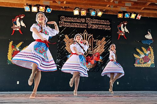 29072022
Petra Anderson, Nina Heisler and Natalia Anderson with Rushnychok Ukrainian Dance perform a Transcarpathian dance during the Talent Competition at Canada's National Ukrainian Festival near Dauphin, Manitoba on a hot Friday afternoon. (Tim Smith/The Brandon Sun)