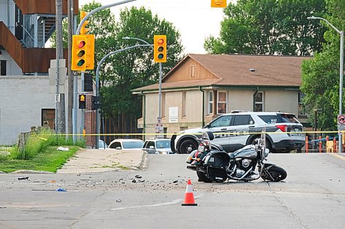 MIKE DEAL / WINNIPEG FREE PRESS
Winnipeg Police investigate a MVC between a white van and a motorcycle at Talbot Avenue and Levis Street. Talbot is closed between Brazier and Stadacona streets while they investigate. 
230614 - Wednesday, June 14, 2023