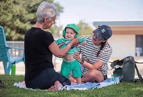 Ruth Bonneville / Free Press

Weather Standup - prepping for the pool 

Little Charlie Moeller, who will be turning 10 months next week, is all smiles as his mom, Kathleen Coutts and Nannie (grandmother) - Catherine Dunn, put his cool bathing suit and hat on him at Sir John Franklin wading pool Wednesday. 

July 31st,  2024

