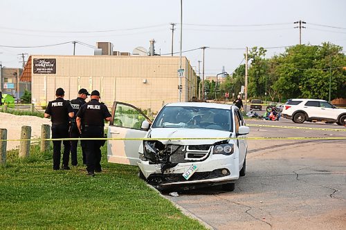 MIKE DEAL / WINNIPEG FREE PRESS
Winnipeg Police investigate a MVC between a white van and a motorcycle at Talbot Avenue and Levis Street. Talbot is closed between Brazier and Stadacona streets while they investigate. 
230614 - Wednesday, June 14, 2023