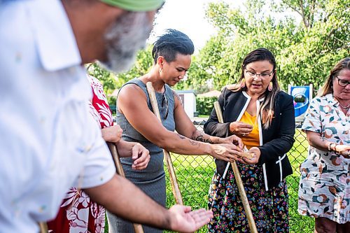 MIKAELA MACKENZIE / FREE PRESS

	
WSD kookum Marsha Missyabit hands tobacco to Vivian Santos, chairperson of the Standing Policy Committee on Community Services, at the groundbreaking of a new basketball court and playground at Northwood Community Centre on Wednesday, July 31, 2024. 

For Jura story.