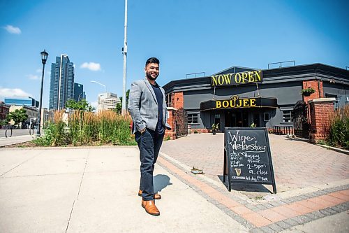 MIKAELA MACKENZIE / FREE PRESS

	
Amit Saini, co-owner of Boujee Restaurant and Bar, in front of the new downtown restaurant on Wednesday, July 31, 2024. 

For Gabby story.