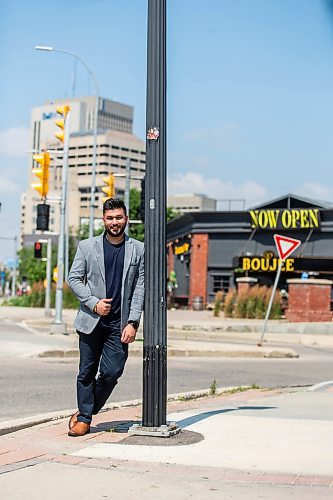 MIKAELA MACKENZIE / FREE PRESS

	
Amit Saini, co-owner of Boujee Restaurant and Bar, in front of the new downtown restaurant on Wednesday, July 31, 2024. 

For Gabby story.