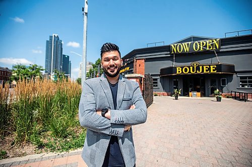 MIKAELA MACKENZIE / FREE PRESS

	
Amit Saini, co-owner of Boujee Restaurant and Bar, in front of the new downtown restaurant on Wednesday, July 31, 2024. 

For Gabby story.