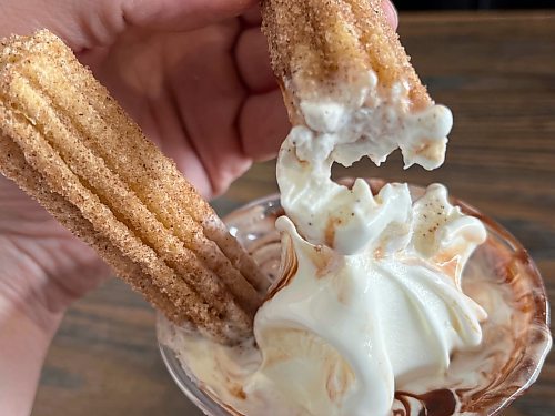 The churro parfait, a local favourite at Minnedosa's Dary Isle Drive-In, is made with two fried and warm churro donuts dipped in cinnamon and sugar, with vanilla soft serve and hot fudge. (Matt Goerzen/The Brandon Sun)