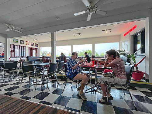 The interior of Minnedosa's Dary Isle Drive-In, sports a classic diner look with booths, black and white checkered floors and black and white pictures from yesteryear on the walls. (Matt Goerzen/The Brandon Sun)