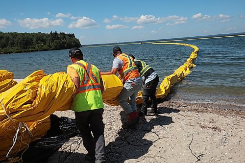 31072024
Workers with ASI Group work to move silt curtains into Clear Lake at the Clear Lake boat cove in Riding Mountain National Park on Wednesday. The silt curtains are being set up in Clear Lake from boat cove to the pier as part of extensive work by Parks Canada in the wake of limited zebra mussel activity being found in the lake. 
(Tim Smith/The Brandon Sun)