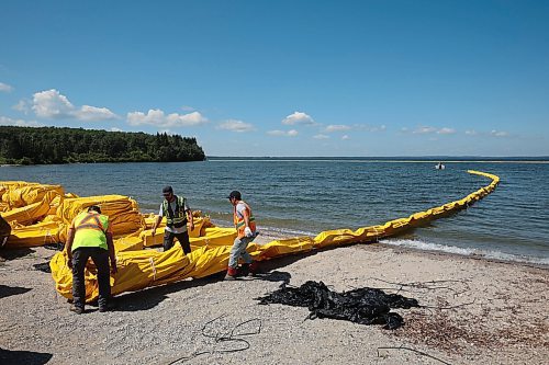 31072024
Workers with ASI Group work to move silt curtains into Clear Lake at the Clear Lake boat cove in Riding Mountain National Park on Wednesday. The silt curtains are being set up in Clear Lake from boat cove to the pier as part of extensive work by Parks Canada in the wake of limited zebra mussel activity being found in the lake. 
(Tim Smith/The Brandon Sun)