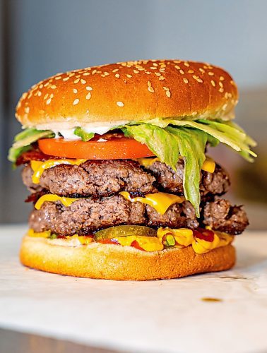 NIC ADAM / FREE PRESS
The monster burger, one of two customer favourite burgers, pictured in the kitchen of Brian&#x2019;s Drive-Inn Wednesday.
240731 - Wednesday, July 31, 2024.

Reporter: Dave
