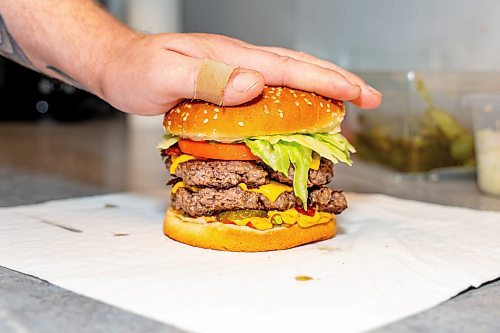 NIC ADAM / FREE PRESS
The monster burger, one of two customer favourite burgers, pictured in the kitchen of Brian&#x2019;s Drive-Inn Wednesday.
240731 - Wednesday, July 31, 2024.

Reporter: Dave
