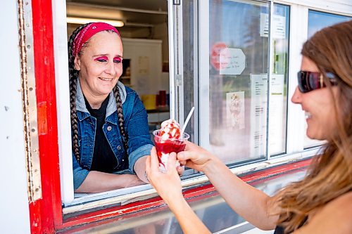 NIC ADAM / FREE PRESS
Tessa Galbichka, manager at Brian&#x2019;s, pictured serving a strawberry Sunday in the kitchen of Brian&#x2019;s Drive-Inn Wednesday.
240731 - Wednesday, July 31, 2024.

Reporter: Dave
