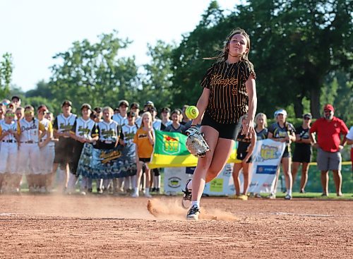 Under-15 Westman Magic pitcher Paige Rampton throws the official opening pitch during the opening ceremonies of the under-13 western Canadian championships at the Ashley Neufeld Softball Complex on Thursday evening. (Perry Bergson/The Brandon Sun)