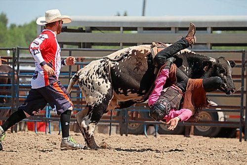 Riley Baird of Big Valley, Alta., is bucked upside down during the junior high bareback event. (Tim Smith/The Brandon Sun)